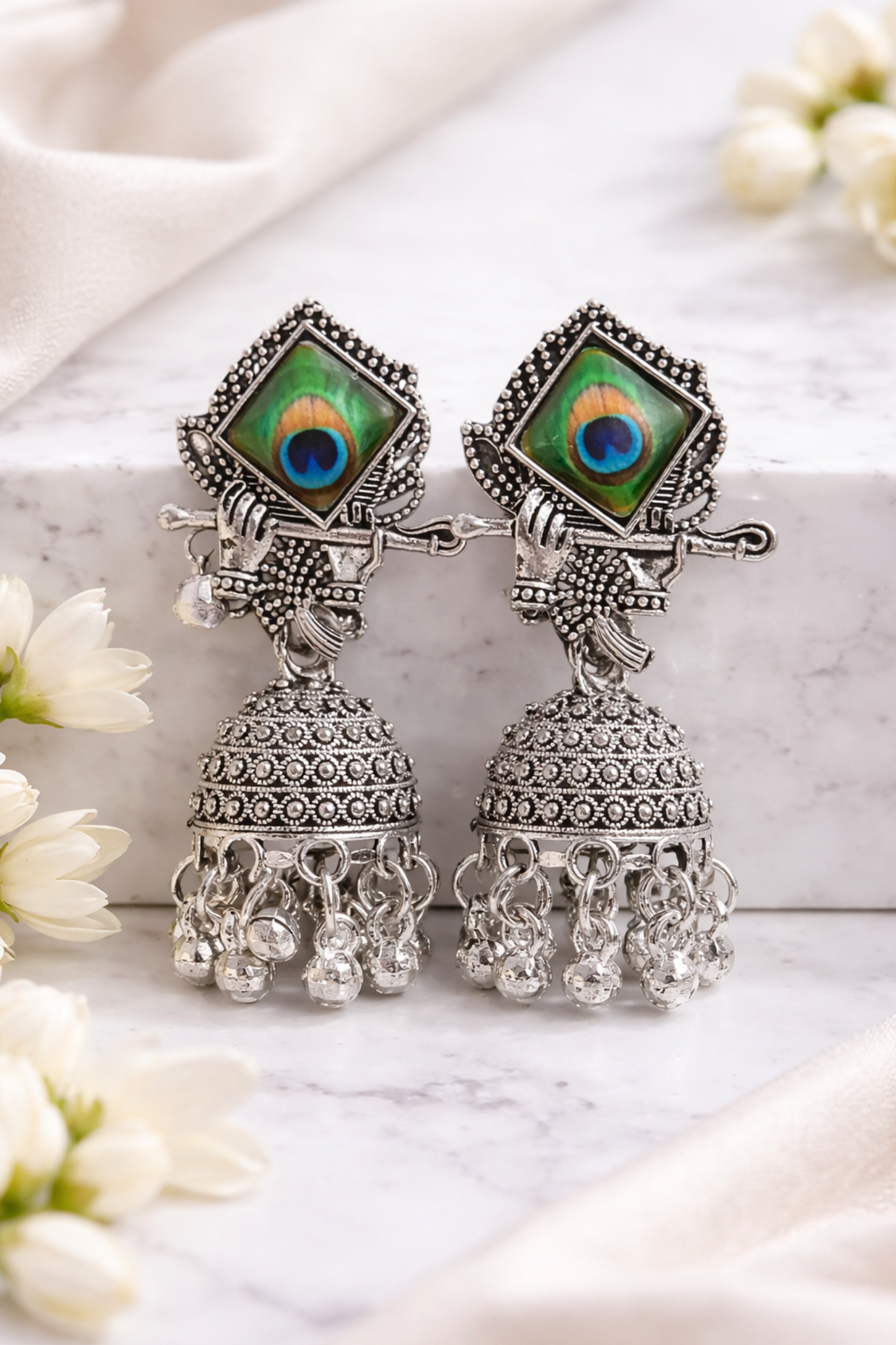 Divine Krishna Flute & Peacock Feather Oxidised Silver Jhumka Earrings